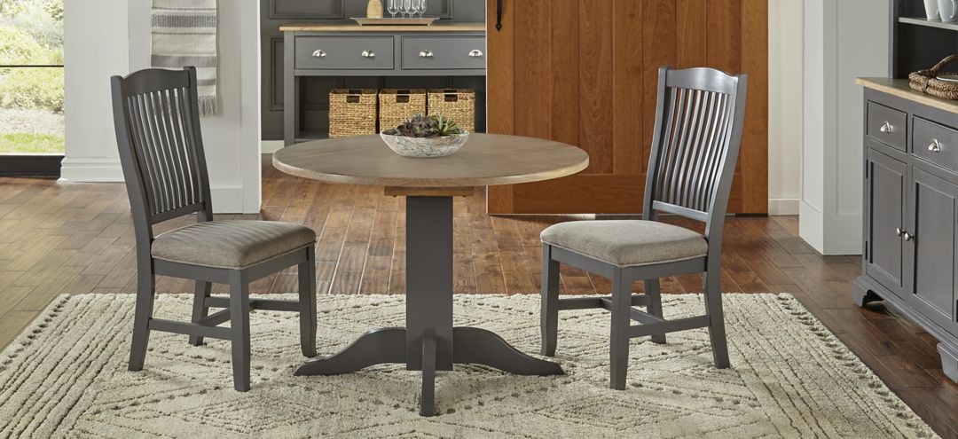 Port Townsend 3-pc. Round Drop-Leaf Upholstered Dining Set